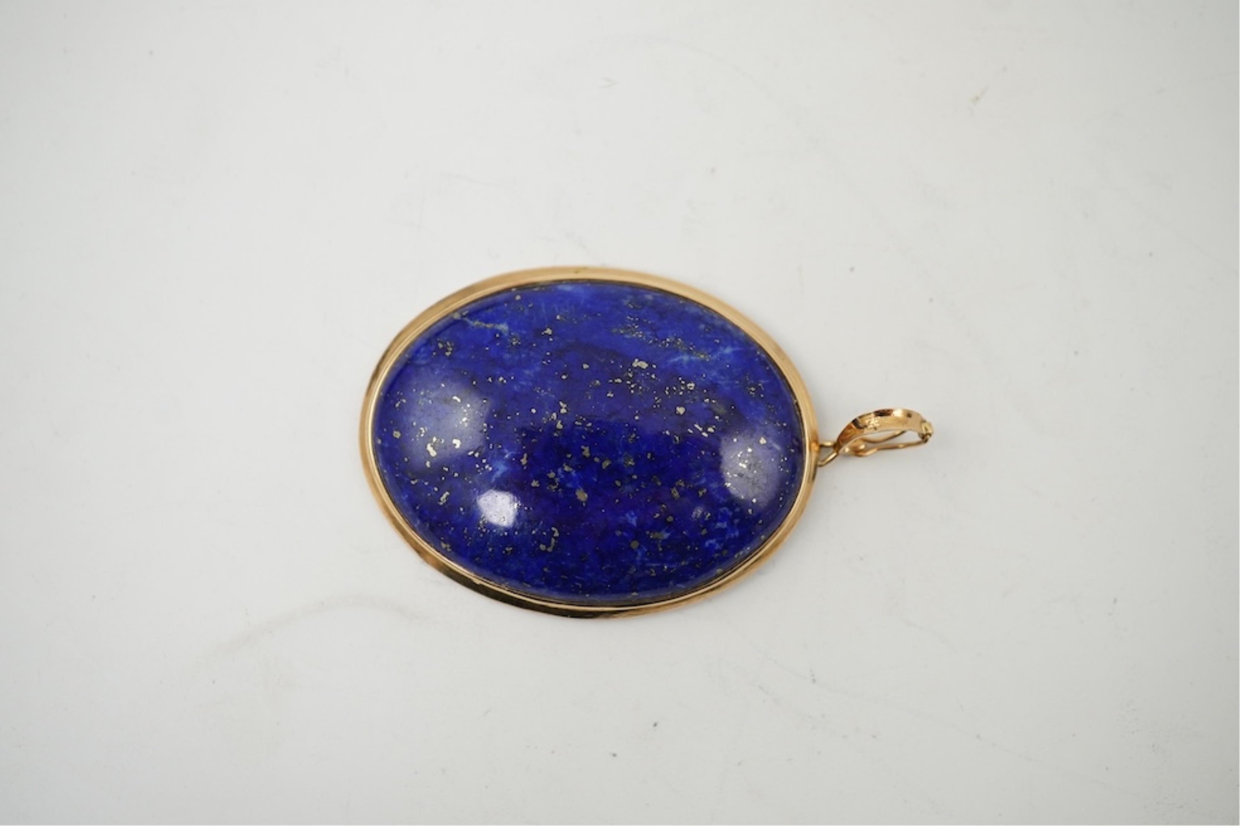 Five assorted modern 375 yellow metal and gem set pendants, a yellow metal and lapis lazuli set pendant (stamped 585?) 40mm, together with a yellow metal dragonfly brooch, a similar small pendant and a white metal bracel